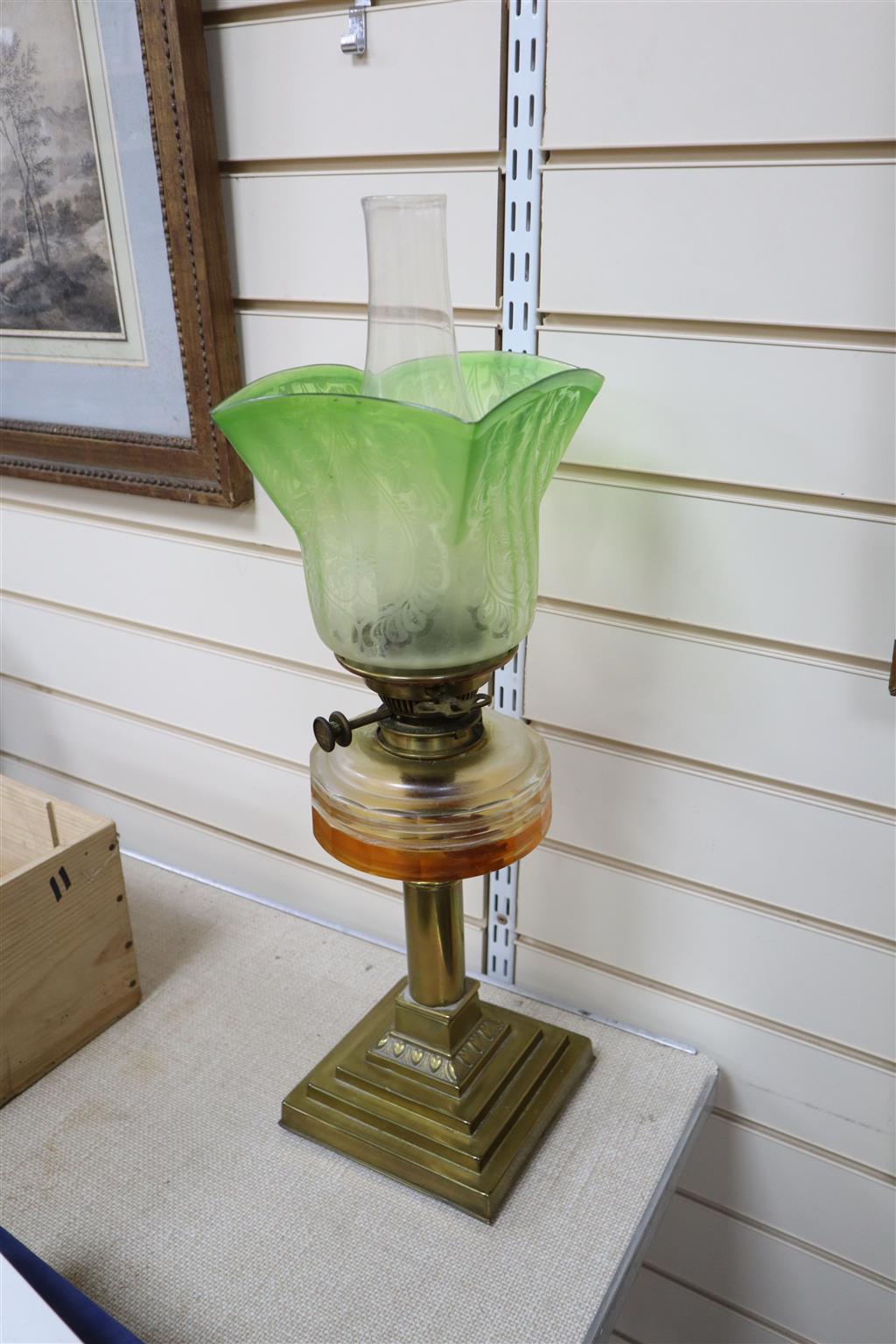 An Edwardian brass and glass oil lamp
